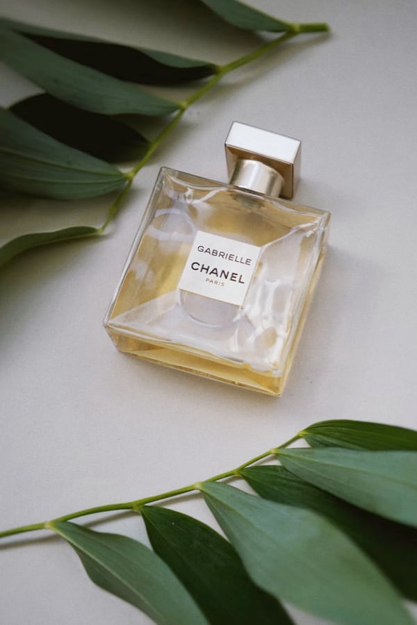 Bottle of CHANEL Perfume surrounded by leaves