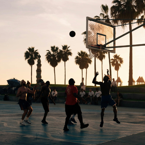 casual outdoor basketball during a sunset